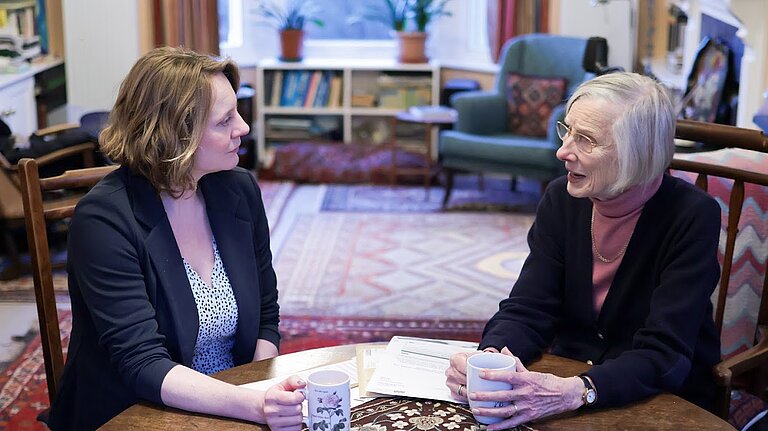 Cheney talking to a local resident about energy bills