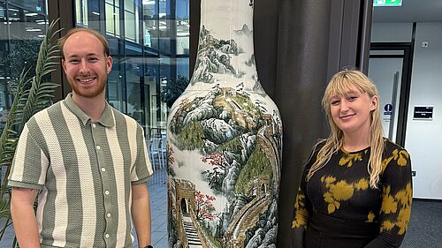 Rory Clark and Yasmin Deter alongside some art