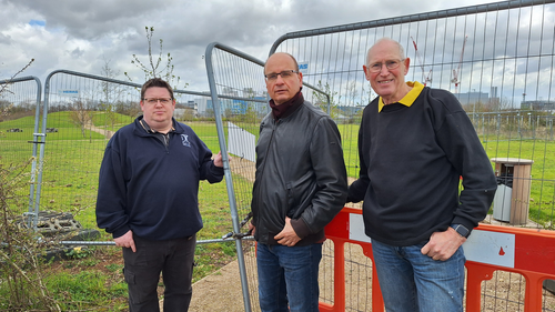 John, Olaf and David by the fence to the closed park