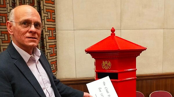 Tim Bick with a post box