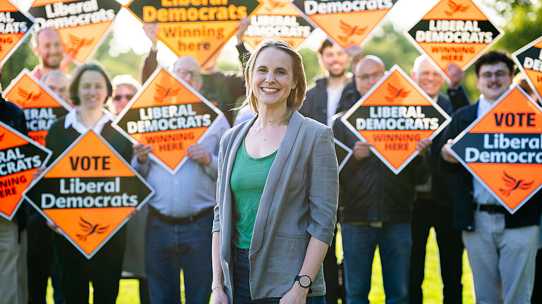 Fionna Tod in front of a group of Lib Dems